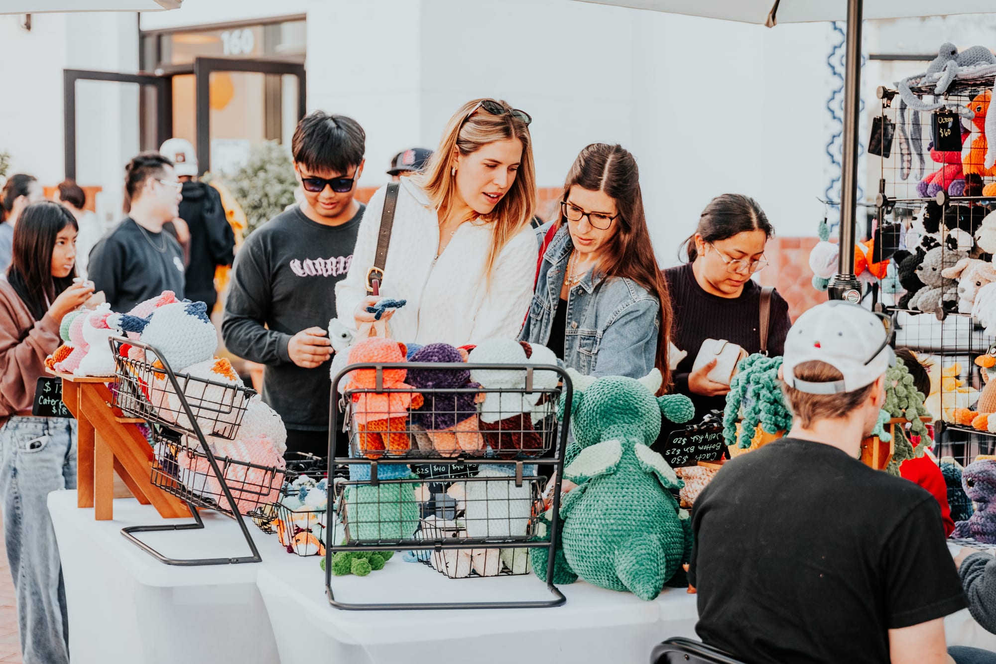Families and friends enjoying a sunny afternoon at a Dreamers Markets pop-up market in Southern California