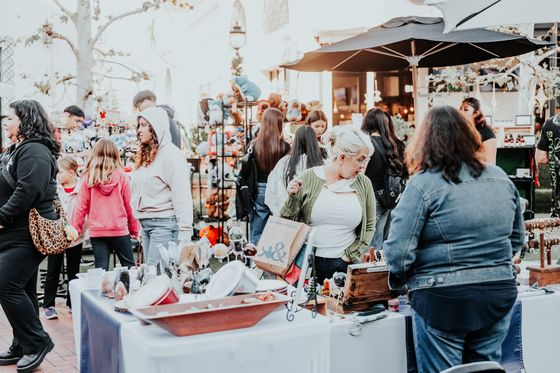 Afternoon market crowd browsing handmade goods